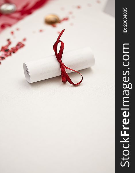 Wedding rolled paper with red ribbon
