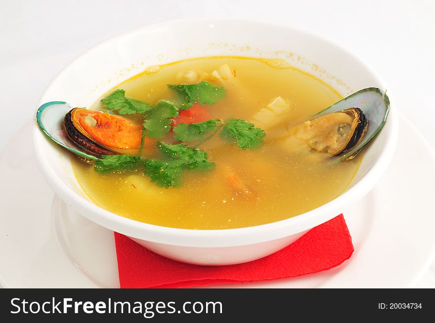 Soup from seafood in a white plate. Soup from seafood in a white plate