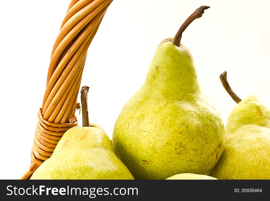 Delicious ripe pears in the basket