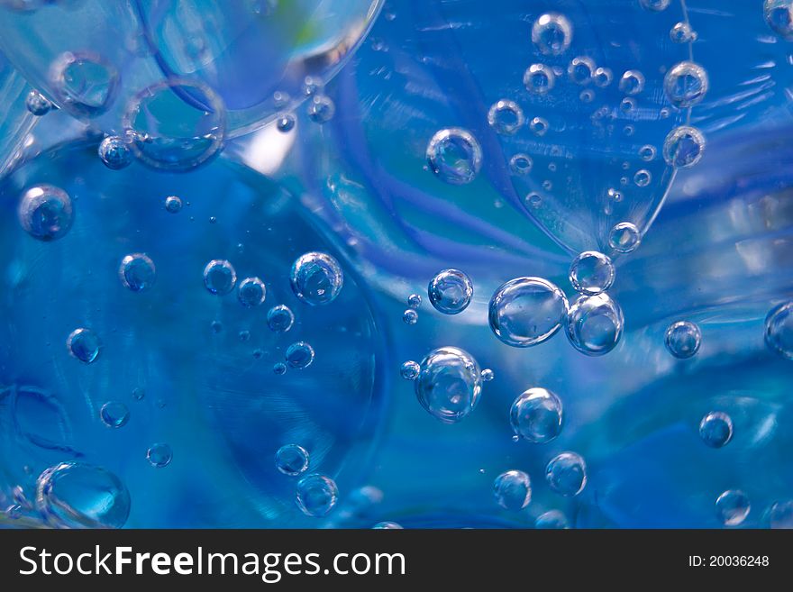 Blue bubbles in water with blue ice