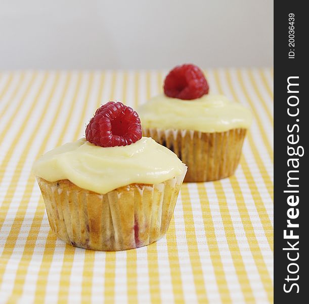 Light fresh berry muffins covered with lemon curd. Light fresh berry muffins covered with lemon curd