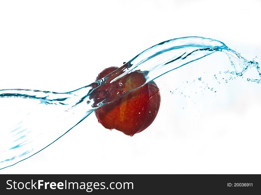 Apple and water splashes mid-air