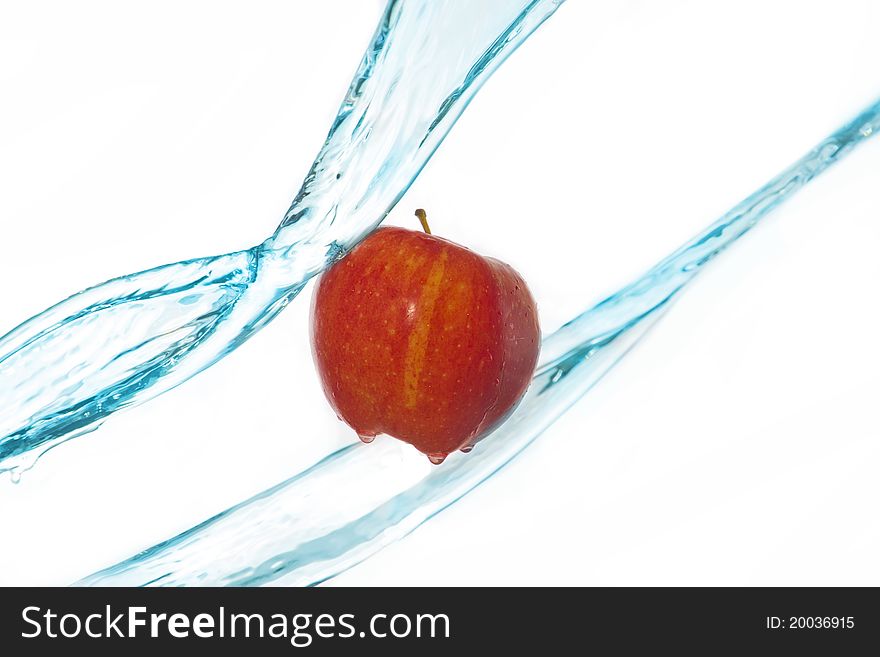 Apple and water splashes mid-air