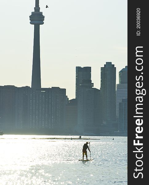 Men padding in font of the CN tower. Men padding in font of the CN tower