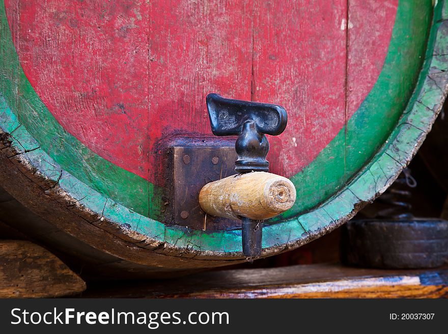 Italy - old tap on a barrel of Barbera wine, Piedmont region. Italy - old tap on a barrel of Barbera wine, Piedmont region