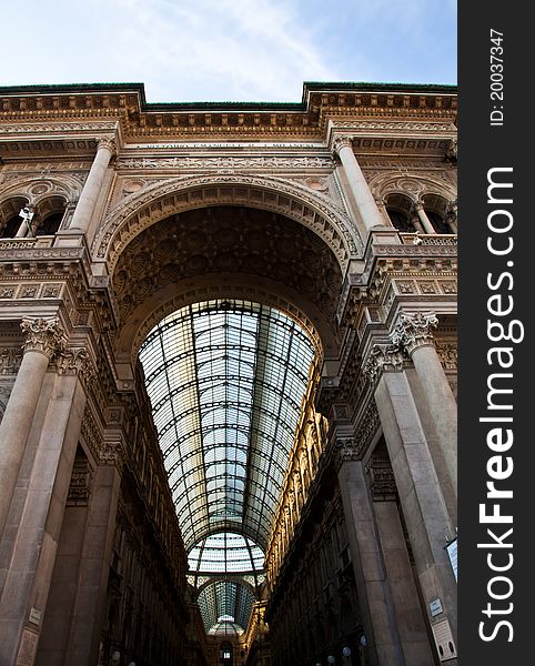 The Galleria Vittorio Emanuele II is a covered double arcade formed of two glass-vaulted arcades at right angles intersecting in an octagon, prominently sited on the northern side of the Piazza del Duomo in Milan. The Galleria Vittorio Emanuele II is a covered double arcade formed of two glass-vaulted arcades at right angles intersecting in an octagon, prominently sited on the northern side of the Piazza del Duomo in Milan.