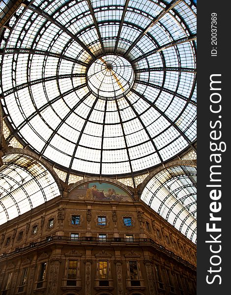 The Galleria Vittorio Emanuele II is a covered double arcade formed of two glass-vaulted arcades at right angles intersecting in an octagon, prominently sited on the northern side of the Piazza del Duomo in Milan. The Galleria Vittorio Emanuele II is a covered double arcade formed of two glass-vaulted arcades at right angles intersecting in an octagon, prominently sited on the northern side of the Piazza del Duomo in Milan.