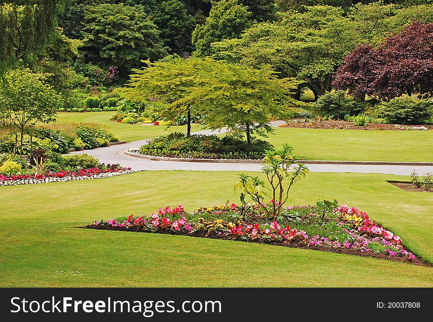 Colorful lush garden in park in the spring. Colorful lush garden in park in the spring