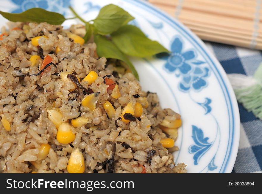 Asian staple diet of healthy fried rice with olive and various vegetables.