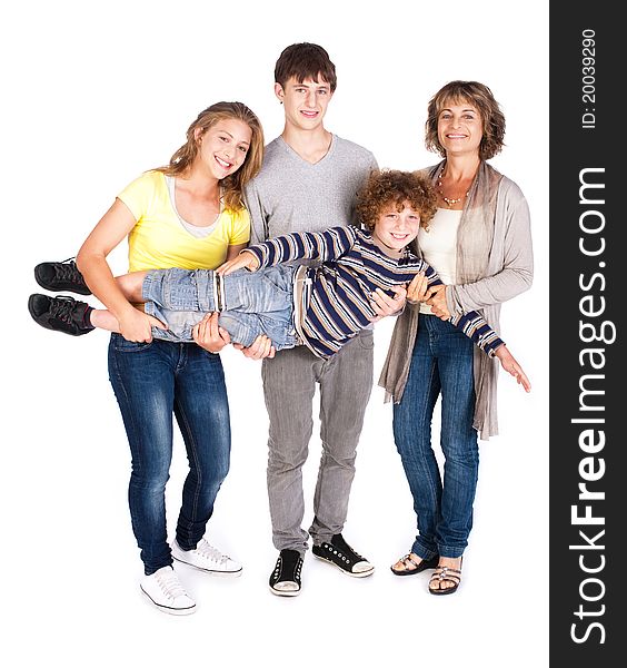 Happy family of four posing in style, indoors.