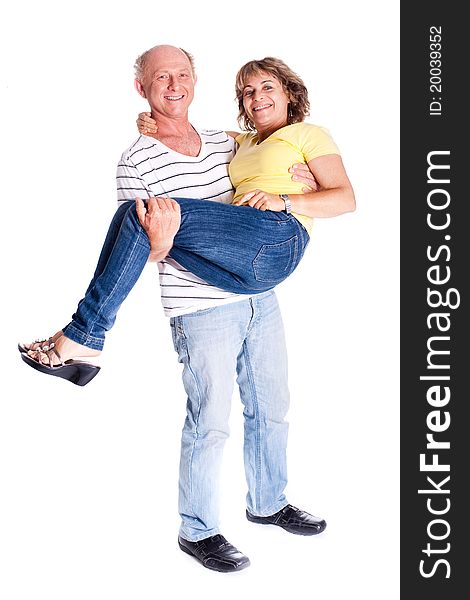 Playful senior couple having fun indoors isolated over white background...