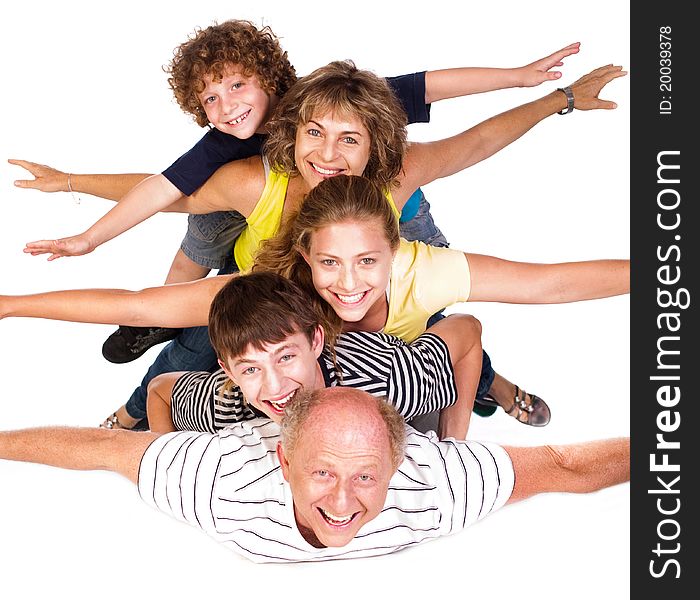 Cheerful family having fun in the studio isolated over the white background..