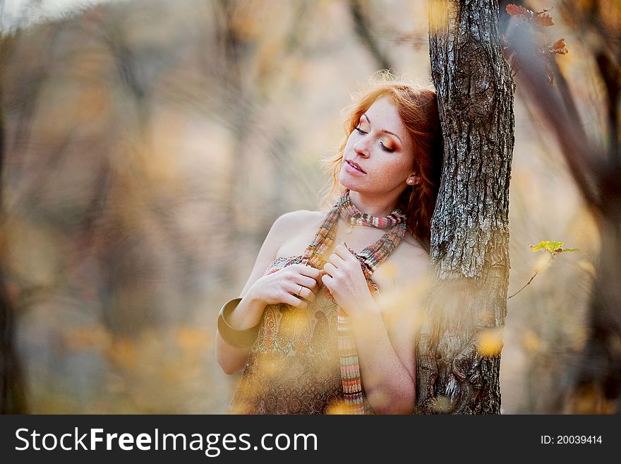 The Red-haired Girl In Autumn Leaves