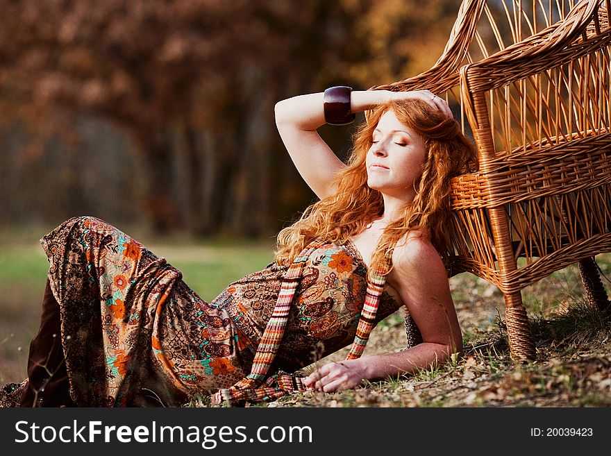 The Red-haired Girl In Autumn Leaves