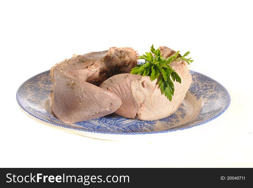 Meat of boiled language lies on a plate