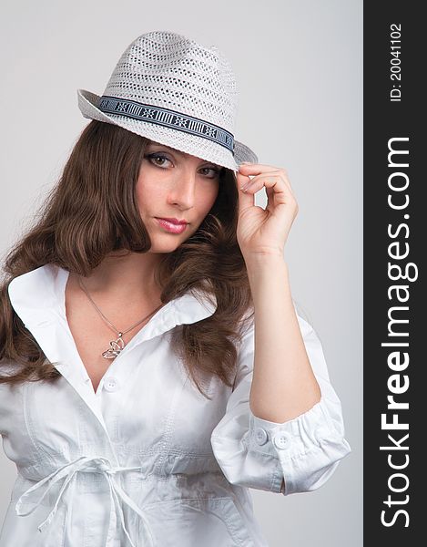 Close-up of beautiful young smiling woman in a hat. Close-up of beautiful young smiling woman in a hat