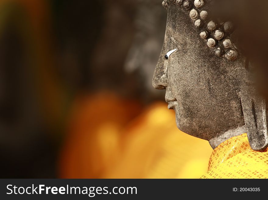 Close up of a Buddha statue at Wat Yai Chai Mongkol in Ayutthaya, Thailand. Close up of a Buddha statue at Wat Yai Chai Mongkol in Ayutthaya, Thailand.