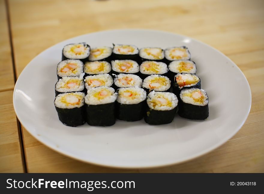 Sushi maki rolls with tempura king shrimp
