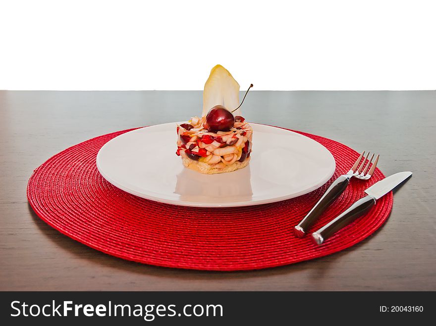 Vegetable dish of cherries and Belgian endive in a cylindrical form. Vegetable dish of cherries and Belgian endive in a cylindrical form