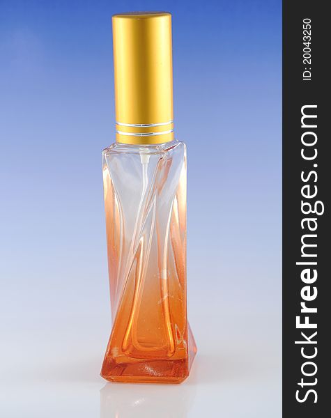 Perfume in a bottle with blue background