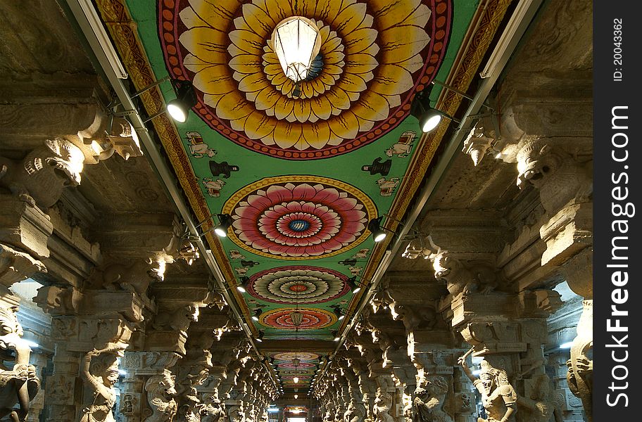 Inside of Meenakshi hindu temple in Madurai, Tamil Nadu, South India. Religious hall of thousands of columns