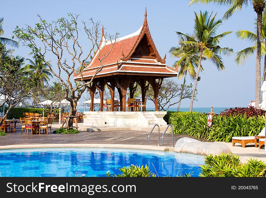 Pool and sea view, blue sky and arbor in the background, Thailand. Pool and sea view, blue sky and arbor in the background, Thailand