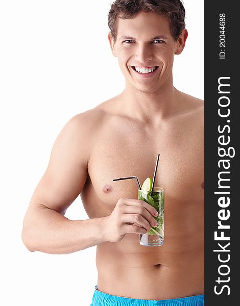 An attractive young man with a mojito on a white background. An attractive young man with a mojito on a white background