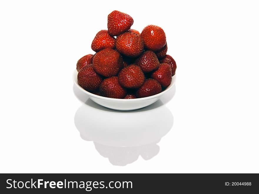 Fresh red strawberries in white bowl on white, nobody, mirror reflection,