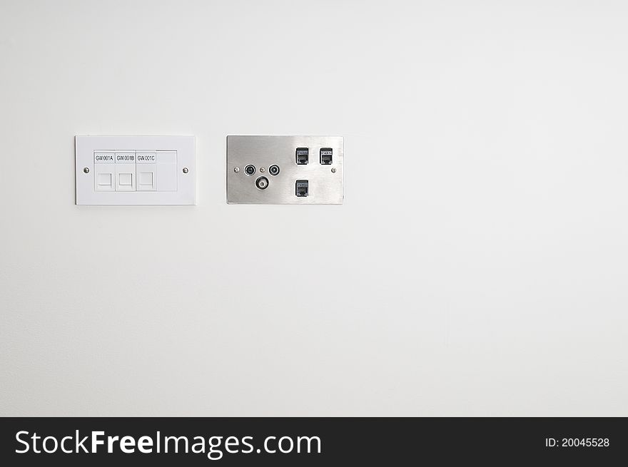 Wall socket for ethernet connections on a white wall. Wall socket for ethernet connections on a white wall