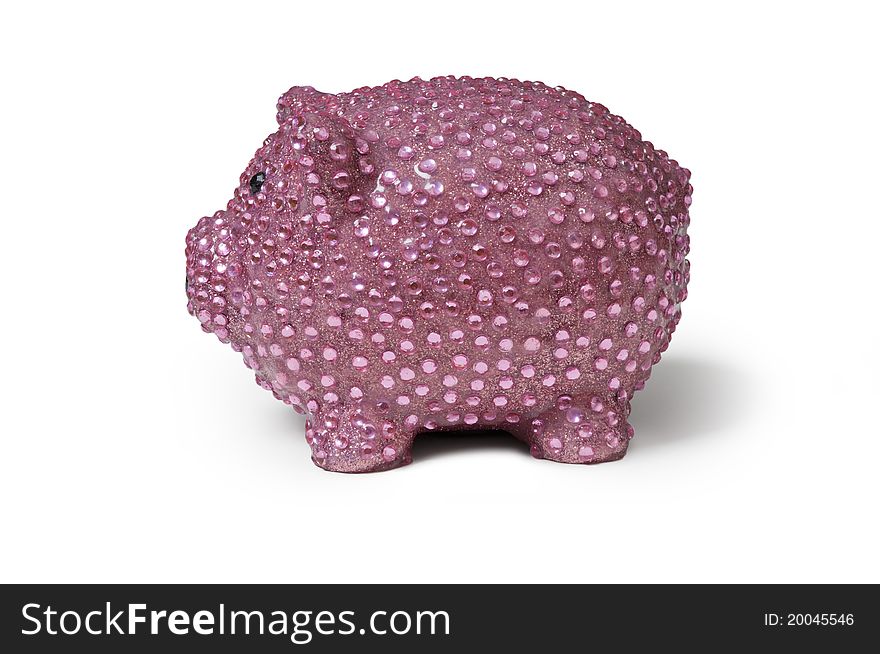 Left side view of a shiny pink piggy bank with sequins isolated against a white background with shadow