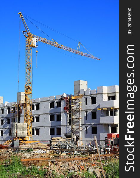 Residential buildings under construction with crane