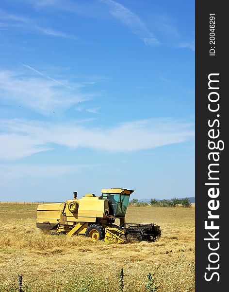 Combine harvester working a wheat field.