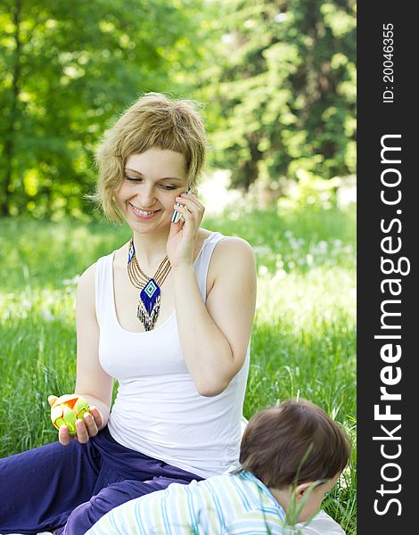 Mother With Son Relaxing Outdoor