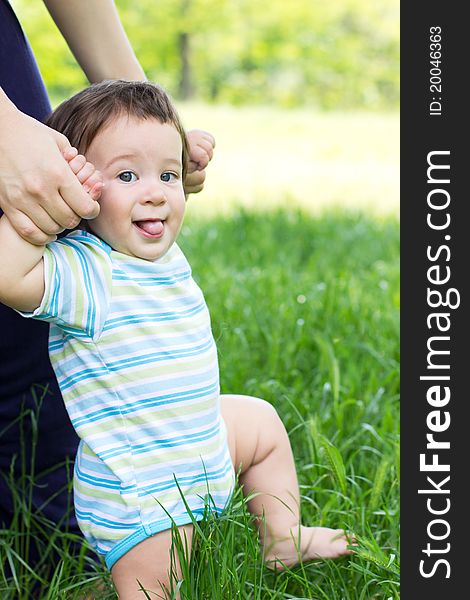 Funny baby on the green grass. Funny baby on the green grass