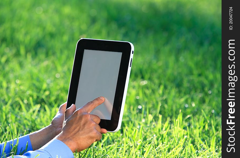 Digital tablet in hands  with outdoor background