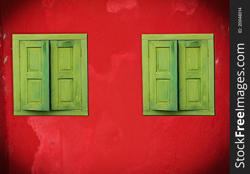 Abstract green windows on red wall. Abstract green windows on red wall