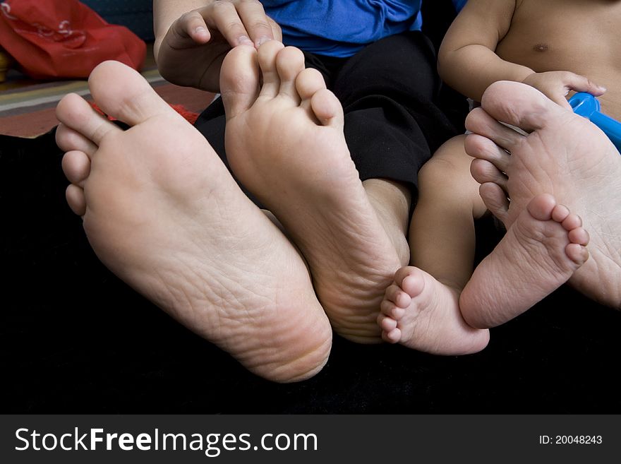 Family Feet, Father, Mother and Baby