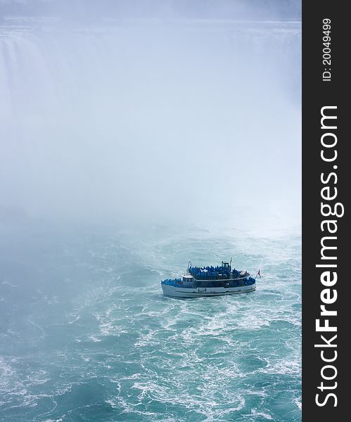 Tourboat under Niagara Falls from Canadian side. Tourboat under Niagara Falls from Canadian side