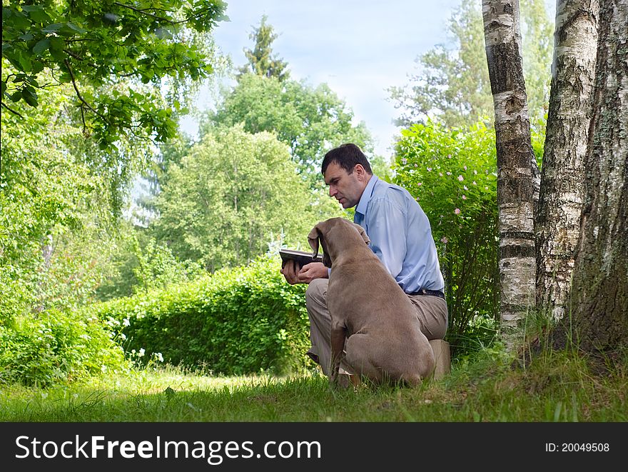Man and dog outdoors in summer