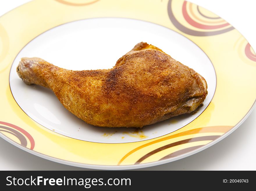 Roasted chicken thighs on ceramics plate