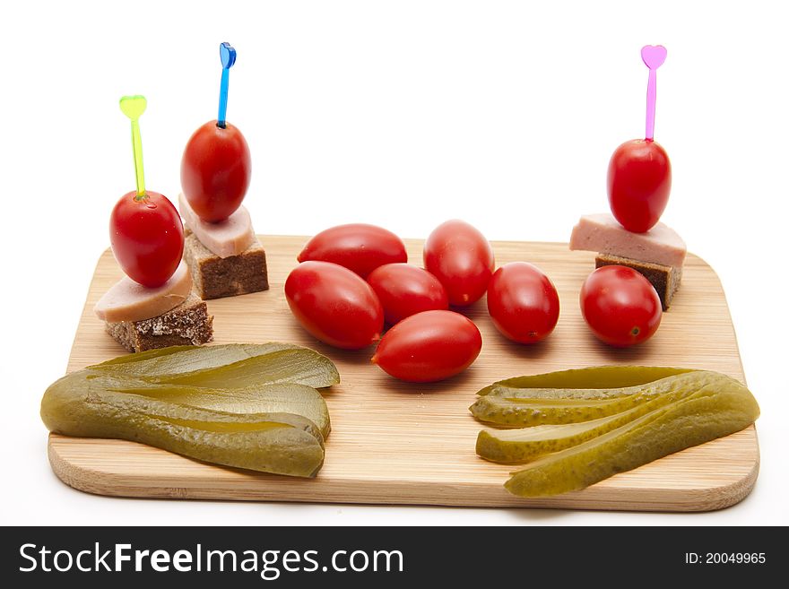 Tomato on spit with sausage and bread