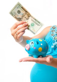 Pregnant Woman With A Piggy Bank Royalty Free Stock Photos