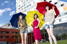 Pretty Young Girls With Umbrellas Stock Photography
