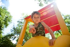 Cute Young Boy On Playground Stock Image
