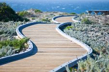 Winding Wooden Walkway Leading Towards The Ocean Stock Images Winding Wooden Walkway Leading Towards The Ocean Stock Images