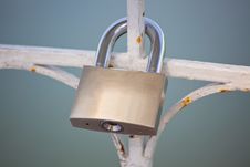 Lock Hanging On The Fence Royalty Free Stock Images