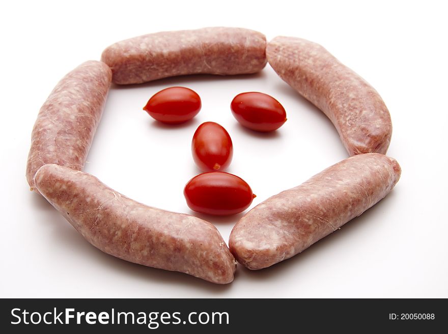 Coarse fried sausage with tomato onto white background