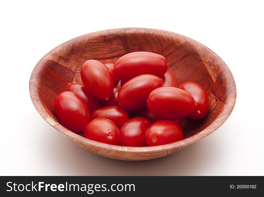 Cocktail tomatoes in the wood bowl