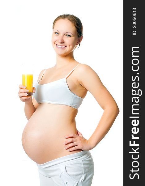 Young pregnant woman with a glass of juice