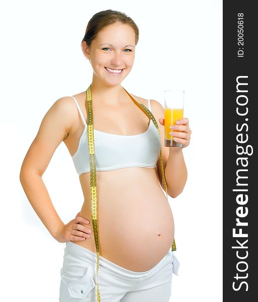 Young pregnant woman with a glass of juice